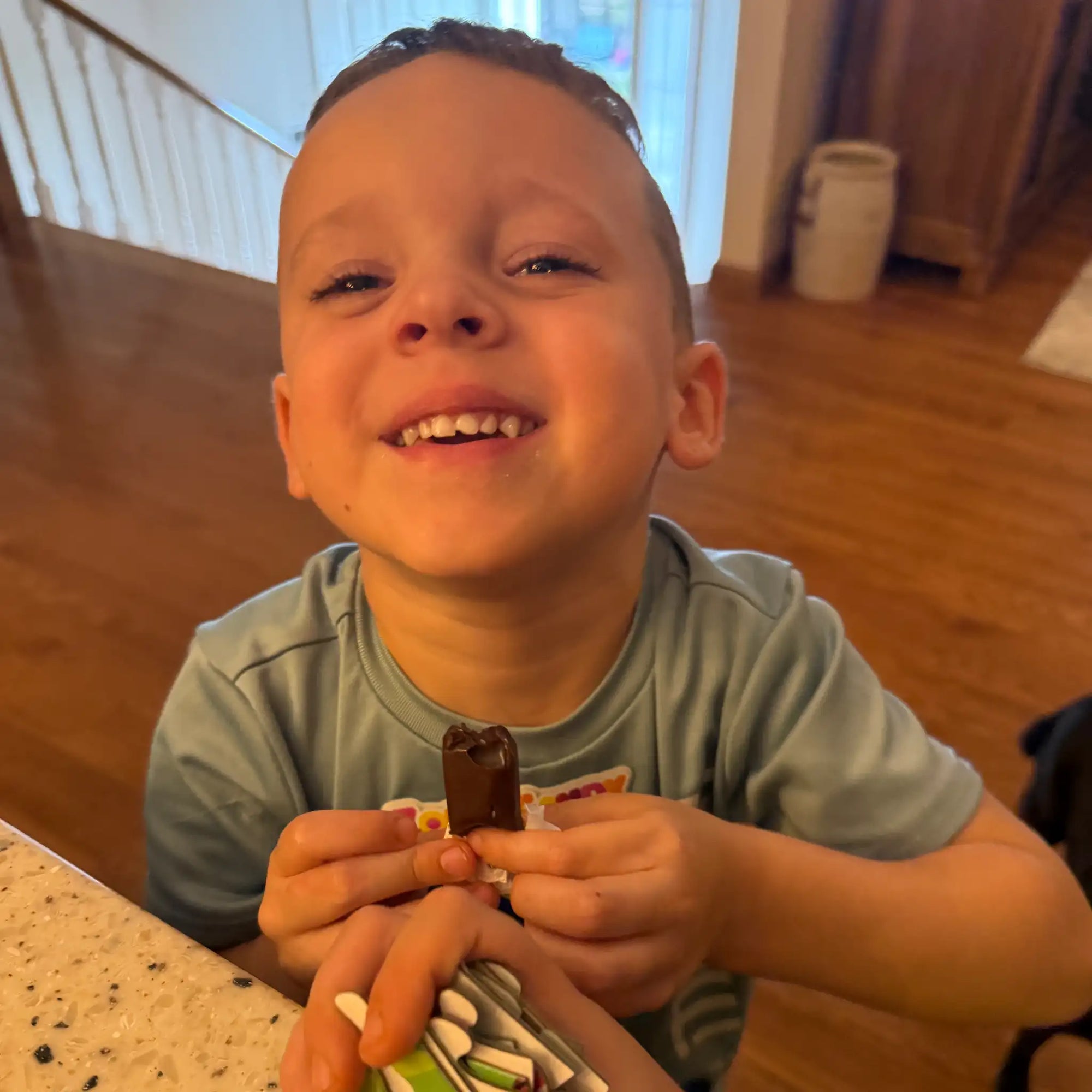 Boy holding a zolli chocolate caramel