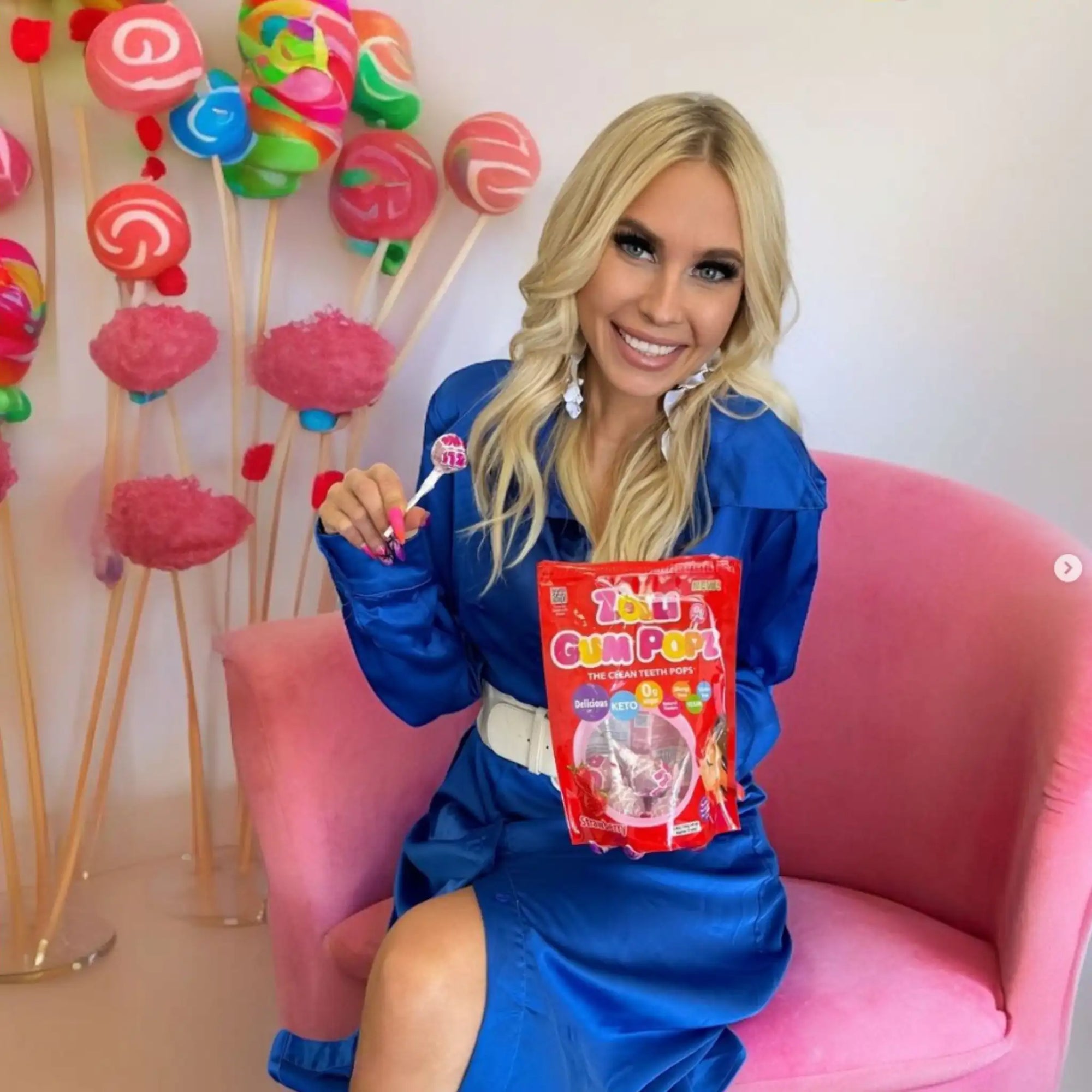 Woman holding a bag of Zolli Gum Pops.