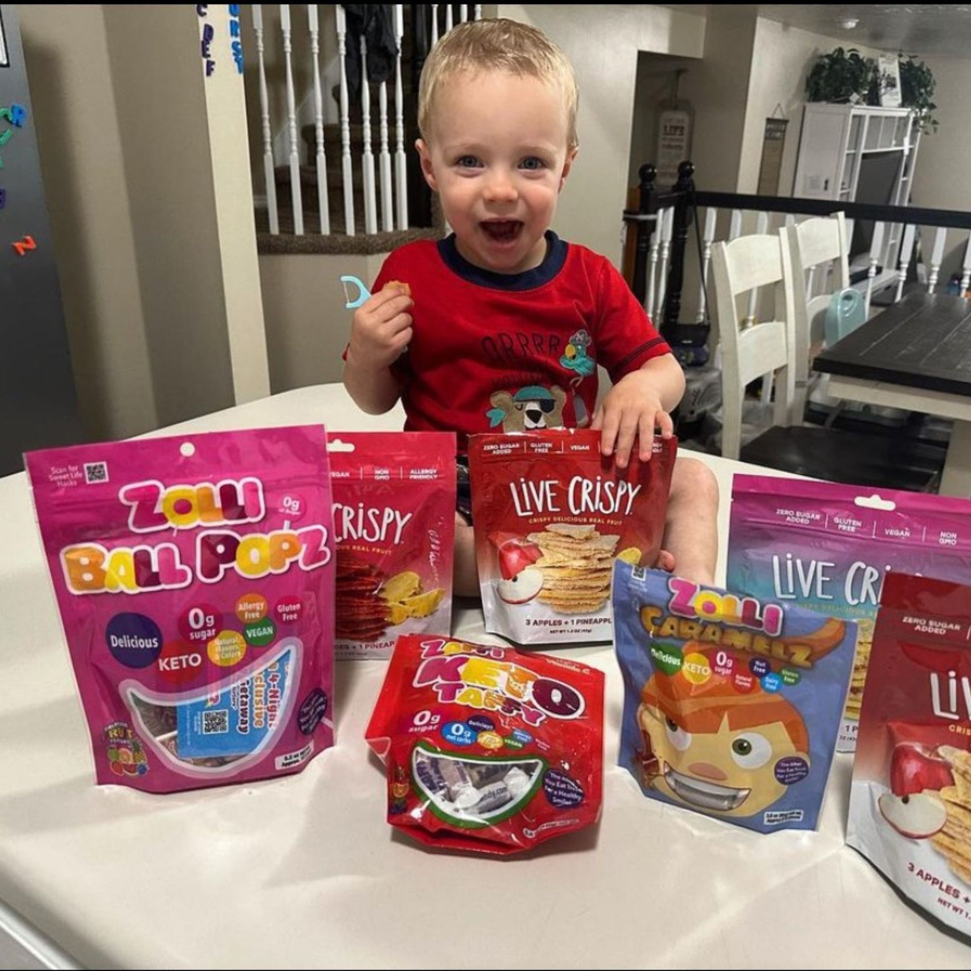 Dental flosser in childs hand with zolli candy bags.