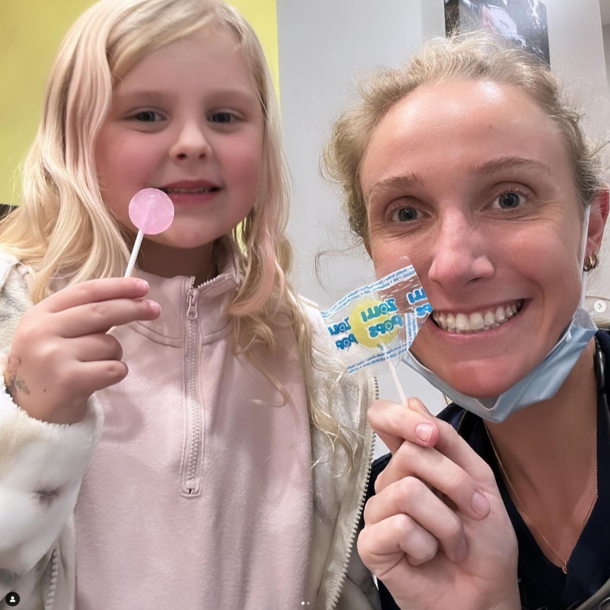 Dental hygienist with her patient and zollipops.