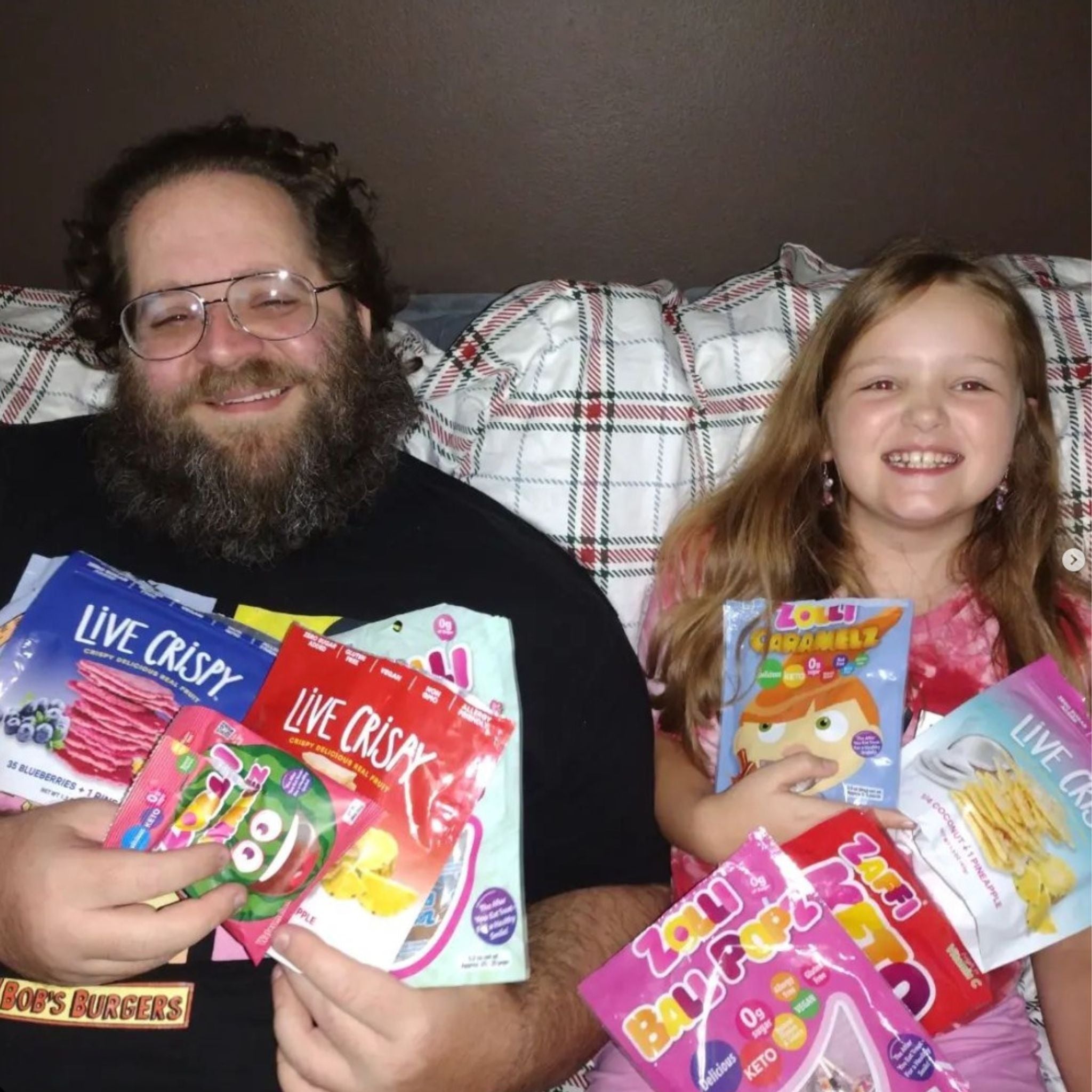 Family holding zolli candy.