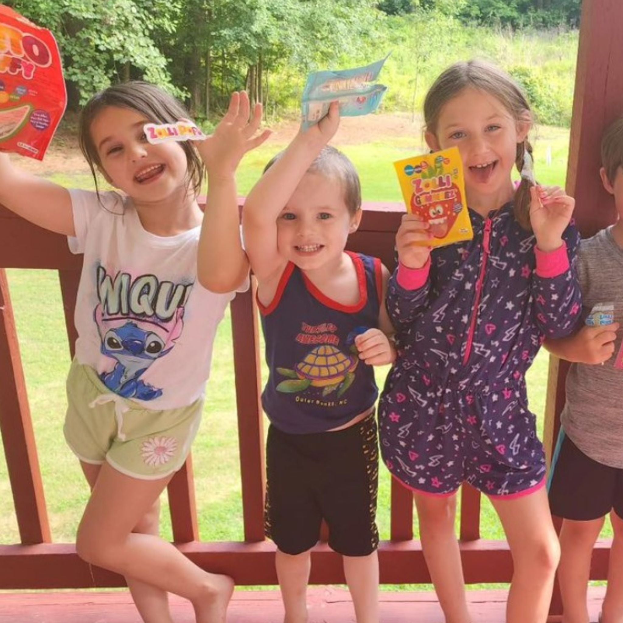 Kids holding bags of zolli candy.