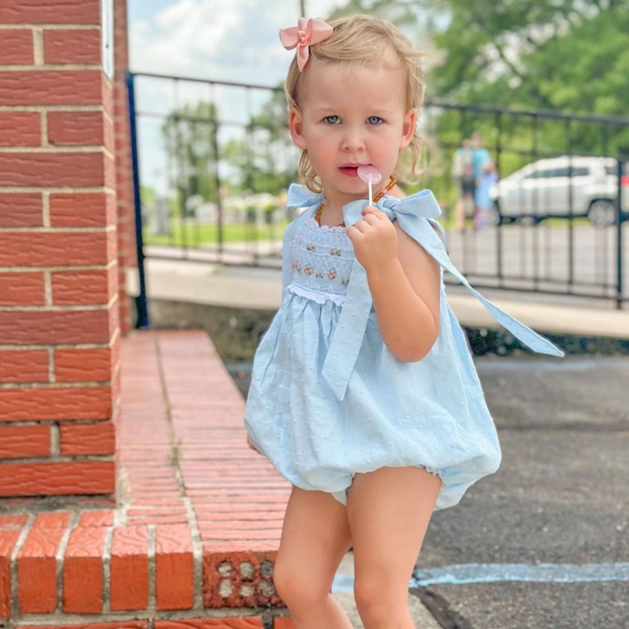 Girl with zollipop.