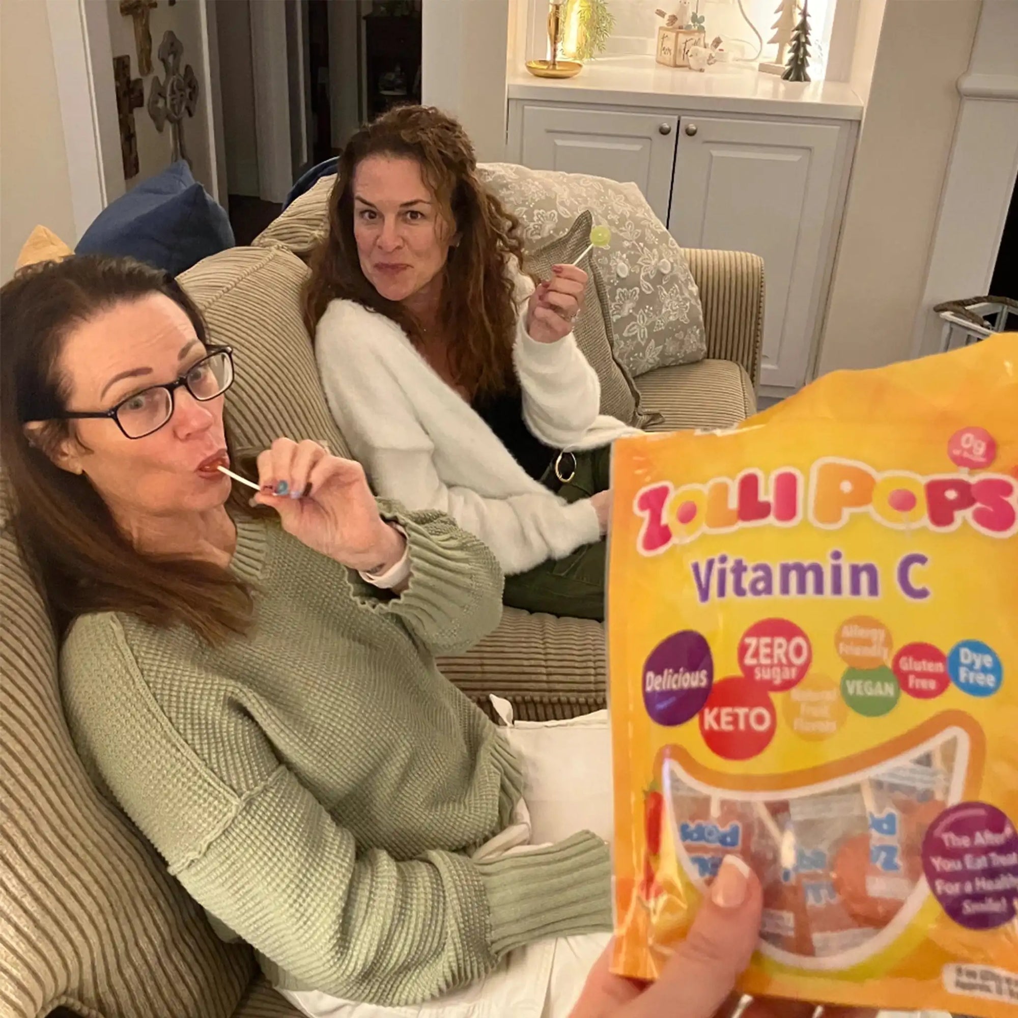 Women enjoying vitamin c zollipops.