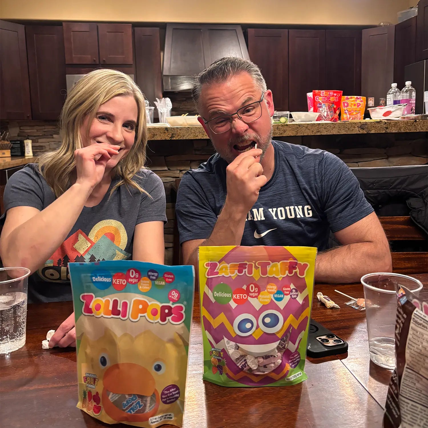 Parents easting easter zolli candy with bags on table.